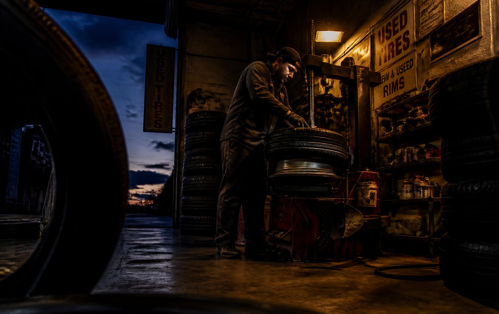 Technician mounting a used tire at Tecos JR in Stafford, Virginia